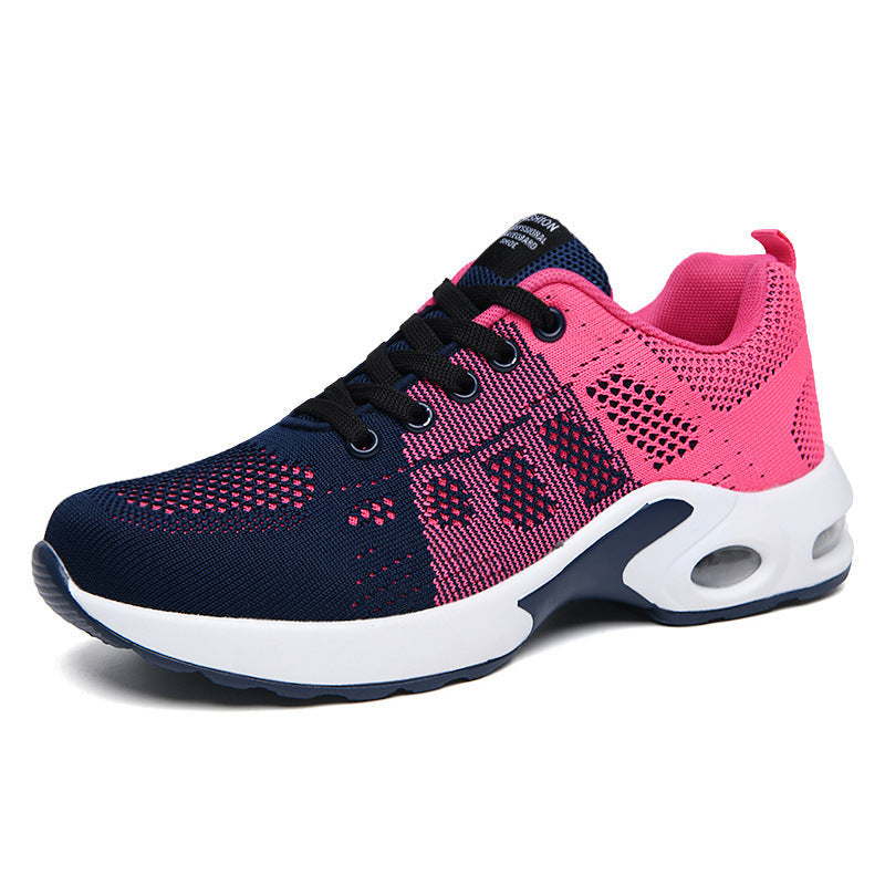 Women's red and white lace-up running trainers with cushioned soles