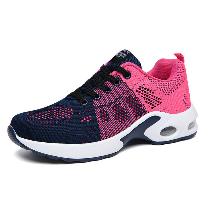 Women's red and white lace-up running trainers with cushioned soles