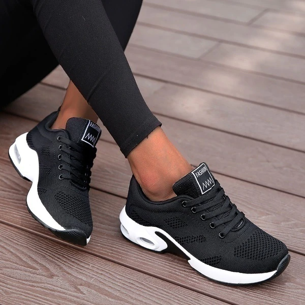 Women's red and white lace-up running trainers with cushioned soles