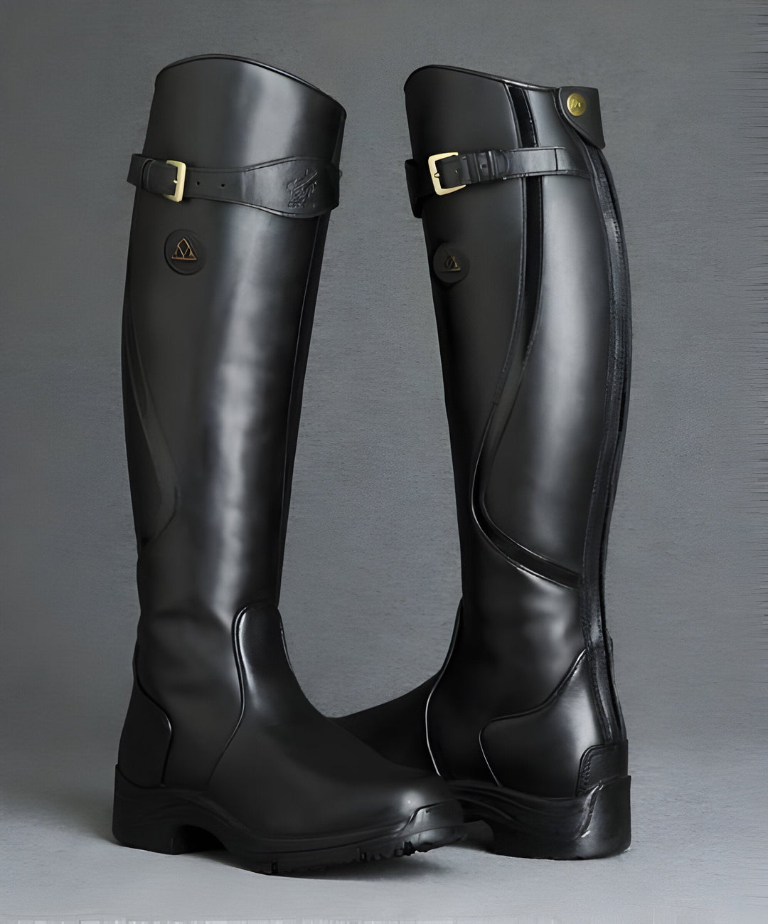Women's tall riding boots with buckle strap and lugged sole