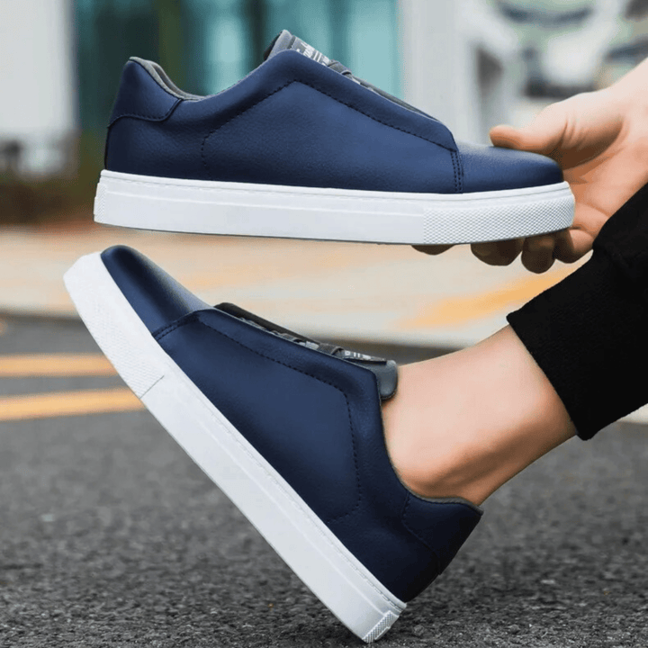 Low-top panelled sneaker with lace-up front and flat sole