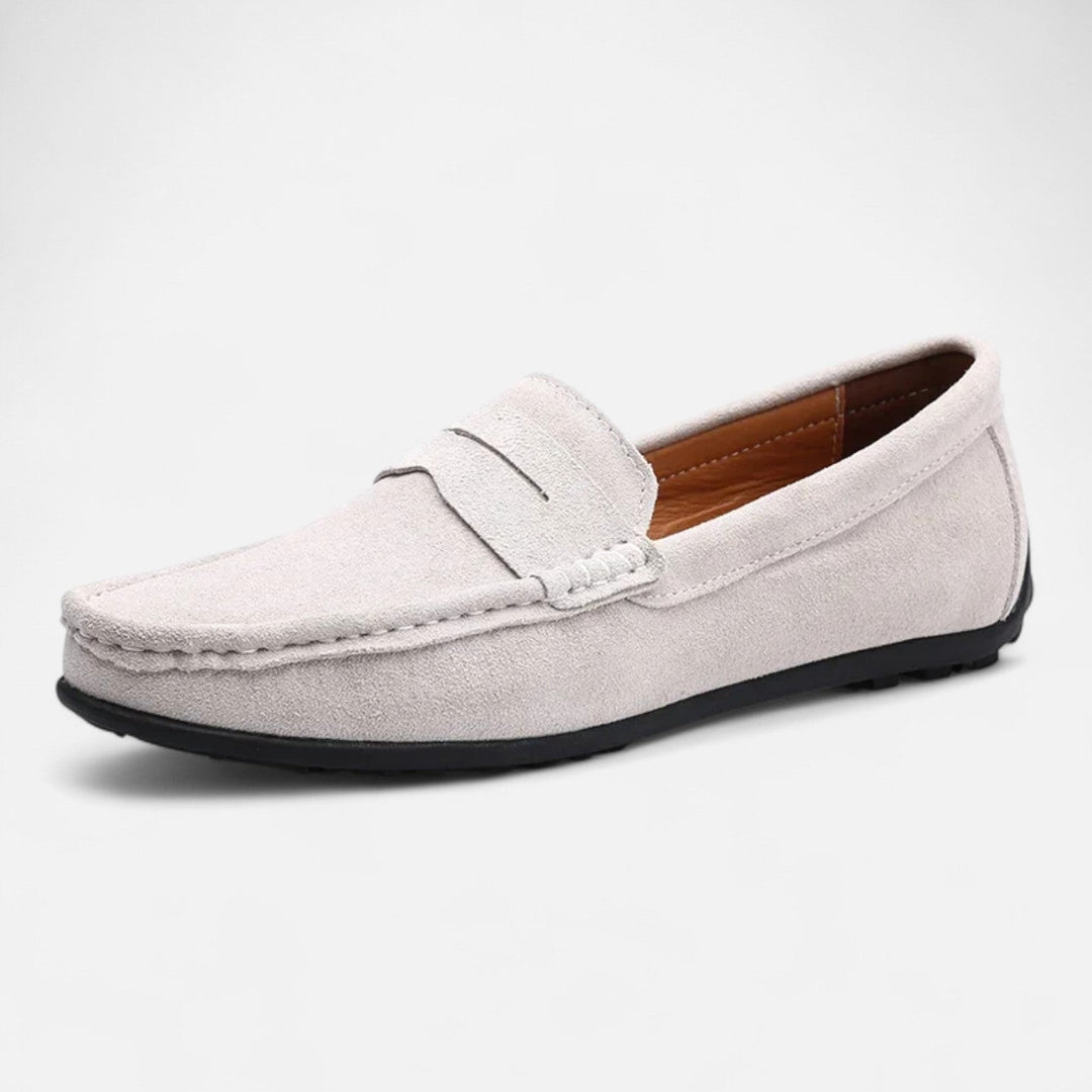 Men's slip-on penny loafer with moc toe stitching and flat sole