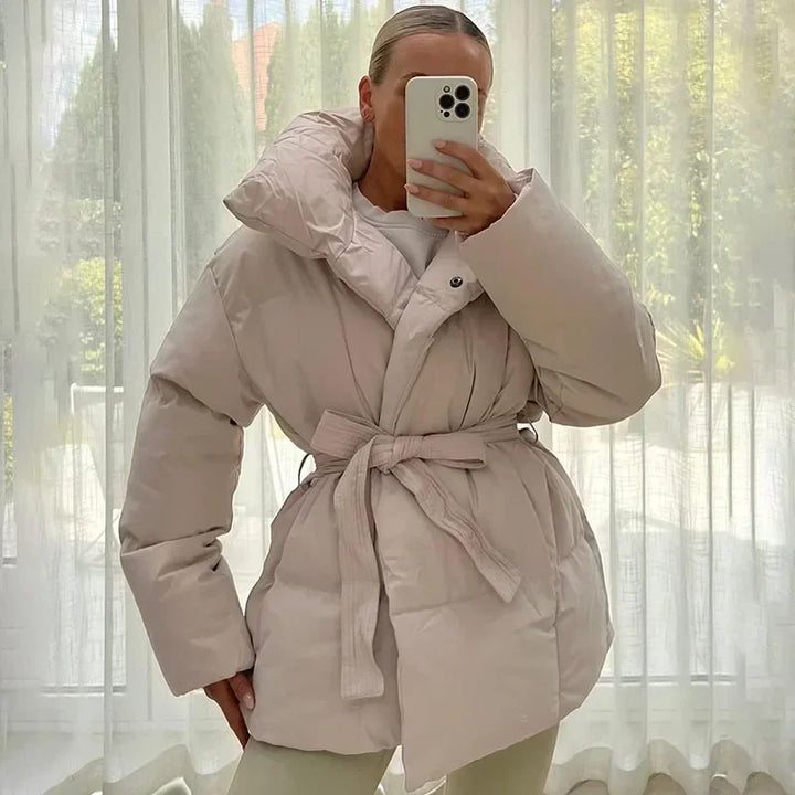 Women's quilted belted puffer parka with high collar and long sleeves
