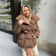 Women's quilted belted puffer parka with high collar and long sleeves