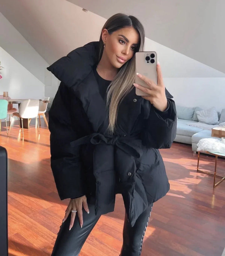Women's quilted belted puffer parka with high collar and long sleeves