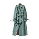 Women's long belted trench coat with notched lapels and cuff straps