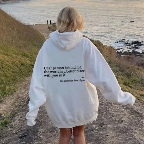 Women's relaxed hooded sweatshirt with contrasting text graphic on the back