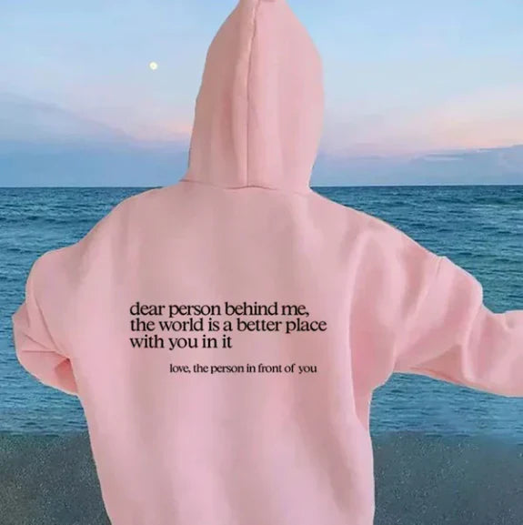 Women's relaxed hooded sweatshirt with contrasting text graphic on the back