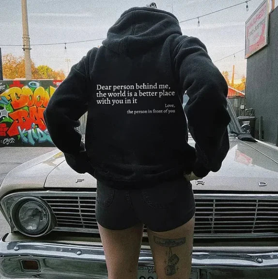 Women's relaxed hooded sweatshirt with contrasting text graphic on the back