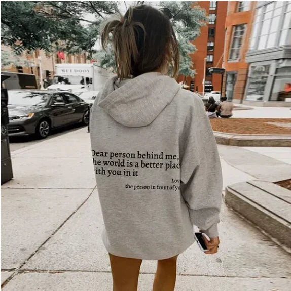 Women's relaxed hooded sweatshirt with contrasting text graphic on the back