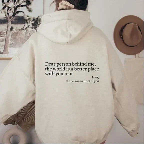 Women's relaxed hooded sweatshirt with contrasting text graphic on the back
