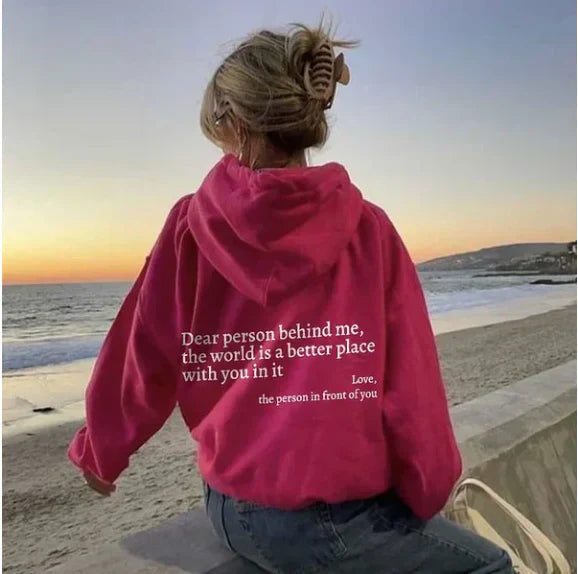 Women's relaxed hooded sweatshirt with contrasting text graphic on the back