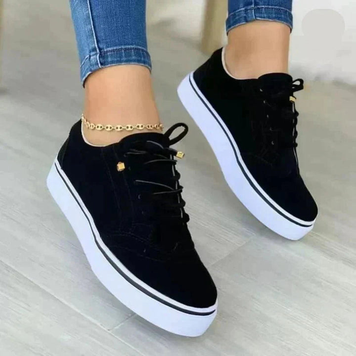 Women's lace-up brogue sneakers with raised white sole