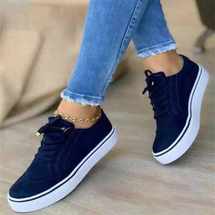 Women's lace-up brogue sneakers with raised white sole