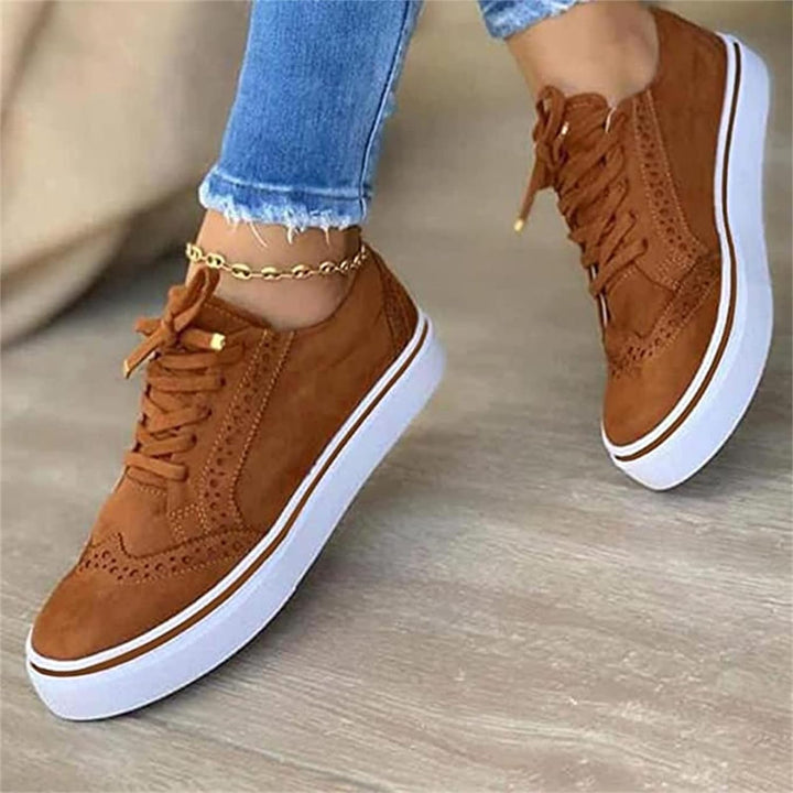 Women's lace-up brogue sneakers with raised white sole