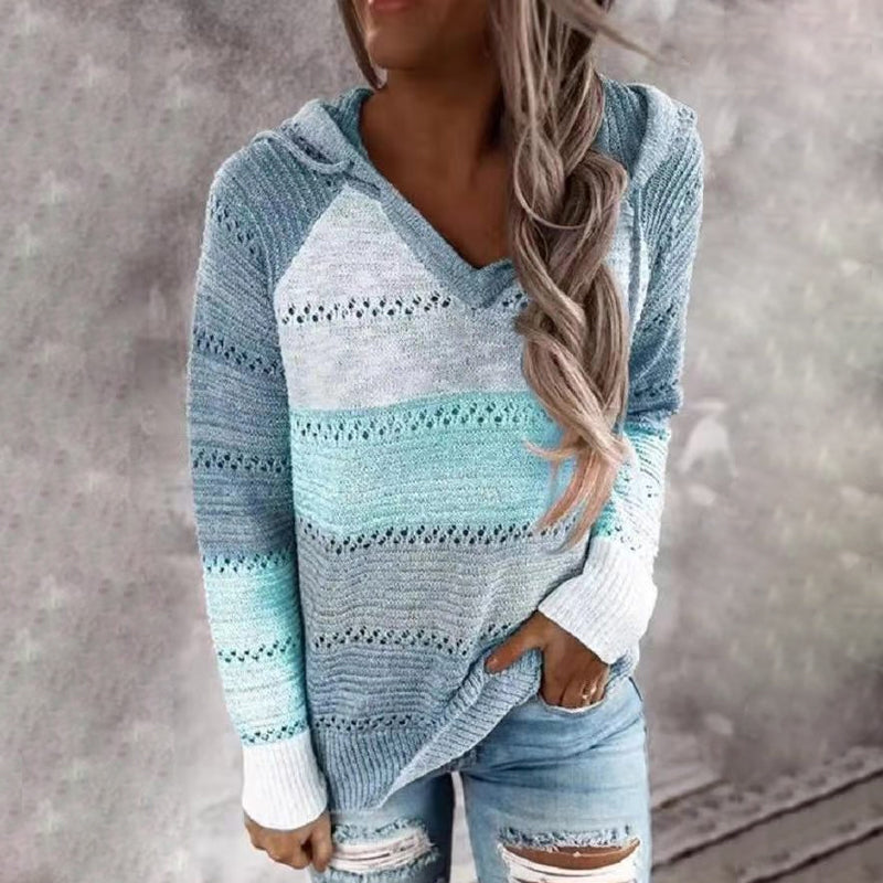 Women's hooded striped knit sweater with long sleeves and ribbed cuffs