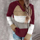 Women's hooded striped knit sweater with long sleeves and ribbed cuffs