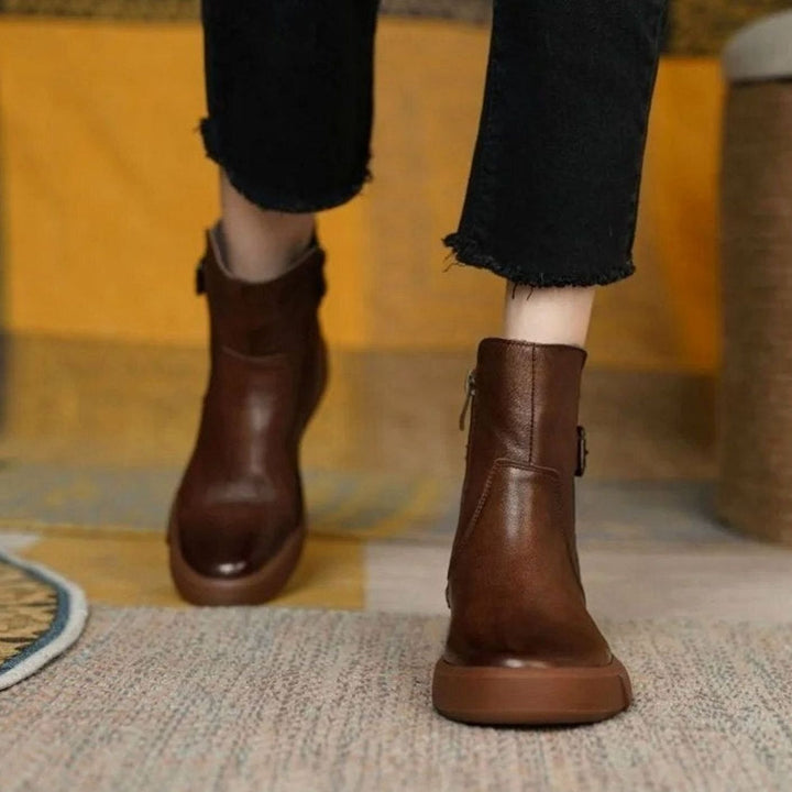 Women's ankle boots with side buckles and low platform soles