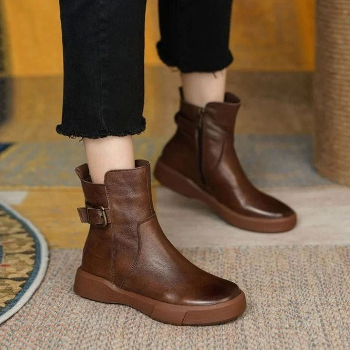 Women's ankle boots with side buckles and low platform soles