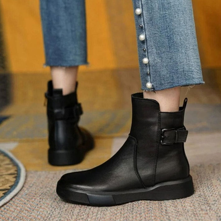 Women's ankle boots with side buckles and low platform soles