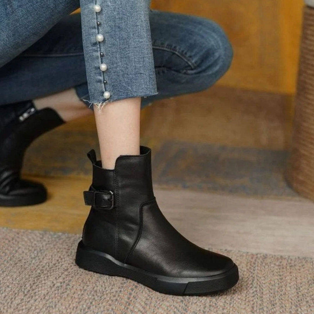 Women's ankle boots with side buckles and low platform soles