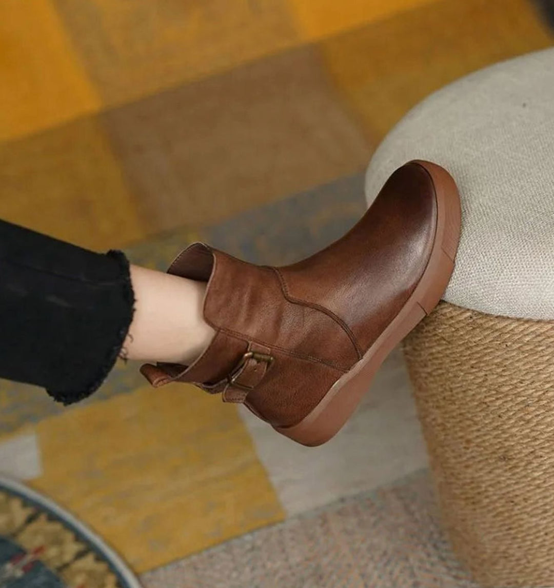 Women's ankle boots with side buckles and low platform soles