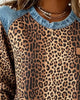Women's leopard print sweatshirt with denim-style patchwork trim and long sleeves