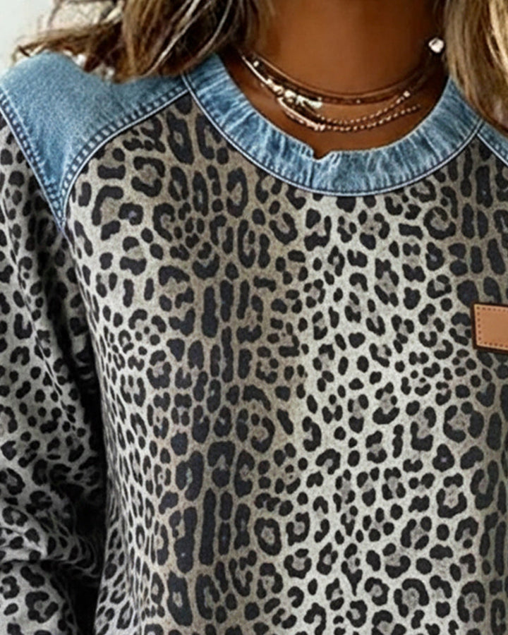 Women's leopard print sweatshirt with denim-style patchwork trim and long sleeves