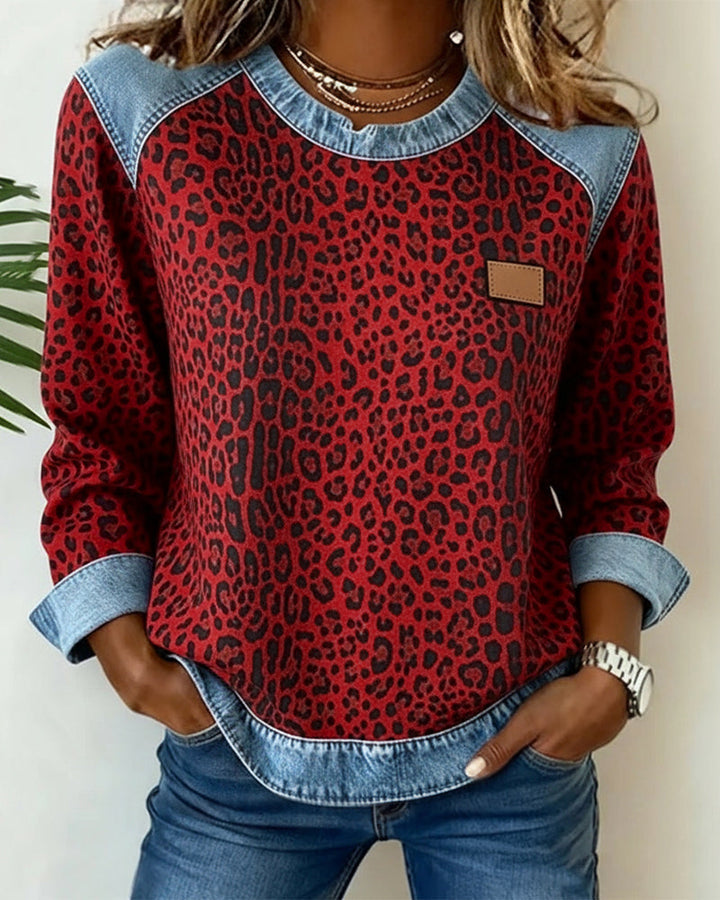 Women's leopard print sweatshirt with denim-style patchwork trim and long sleeves