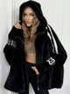 Women's hooded faux fur longline coat with contrast sleeve stripes
