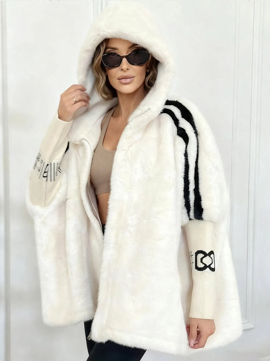 Women's hooded faux fur longline coat with contrast sleeve stripes