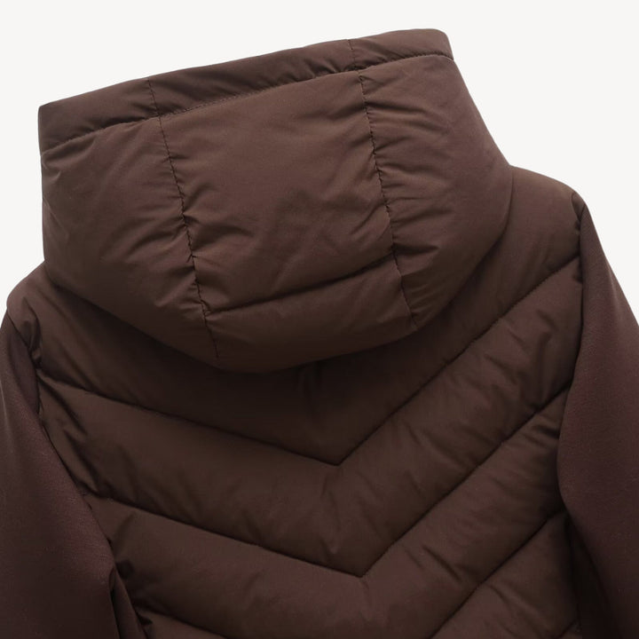 Women's hooded quilted jacket with chevron front, long sleeves and zip fastening