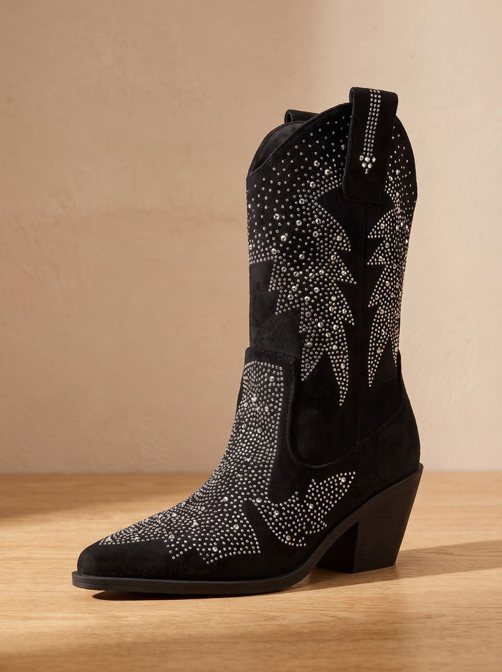 Black pointed-toe cowboy boots with silver rhinestone motifs and block heels