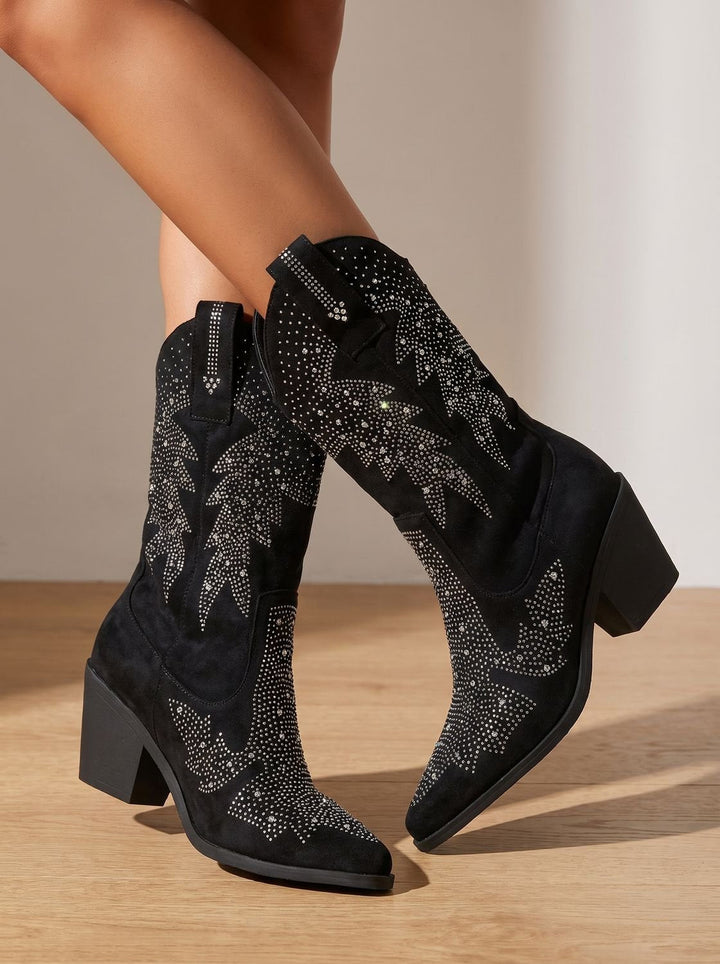 Black pointed-toe cowboy boots with silver rhinestone motifs and block heels