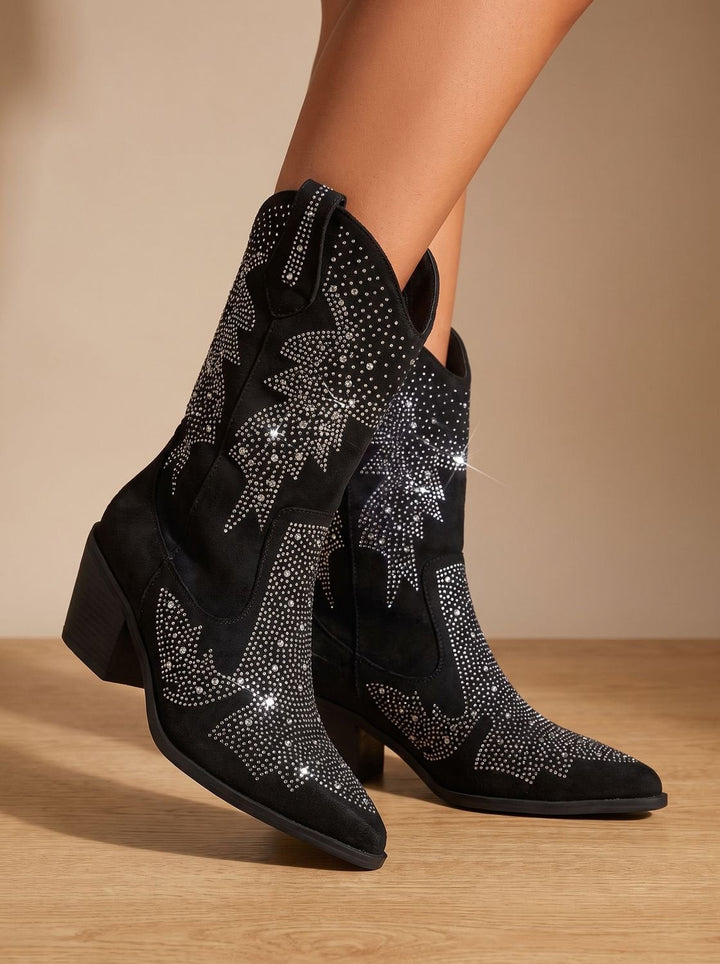 Black pointed-toe cowboy boots with silver rhinestone motifs and block heels