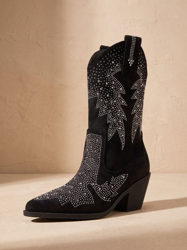 Black pointed-toe cowboy boots with silver rhinestone motifs and block heels