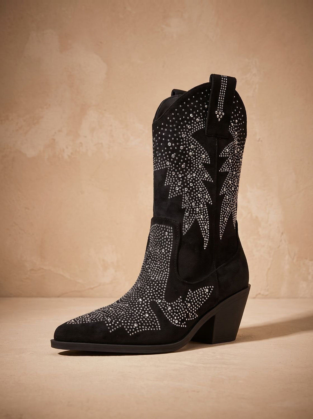 Black pointed-toe cowboy boots with silver rhinestone motifs and block heels