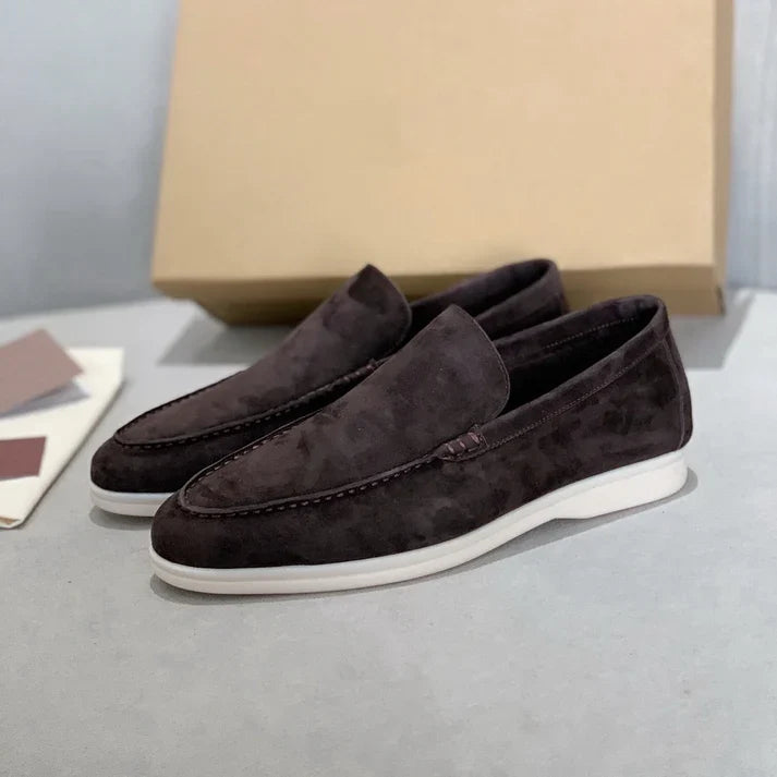 Slip-on loafers with moc-toe stitching and flat contrasting soles