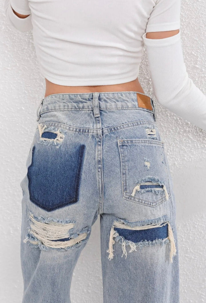Women's high-waist straight-leg jeans with distressed rips and five pockets