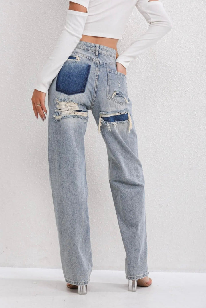 Women's high-waist straight-leg jeans with distressed rips and five pockets