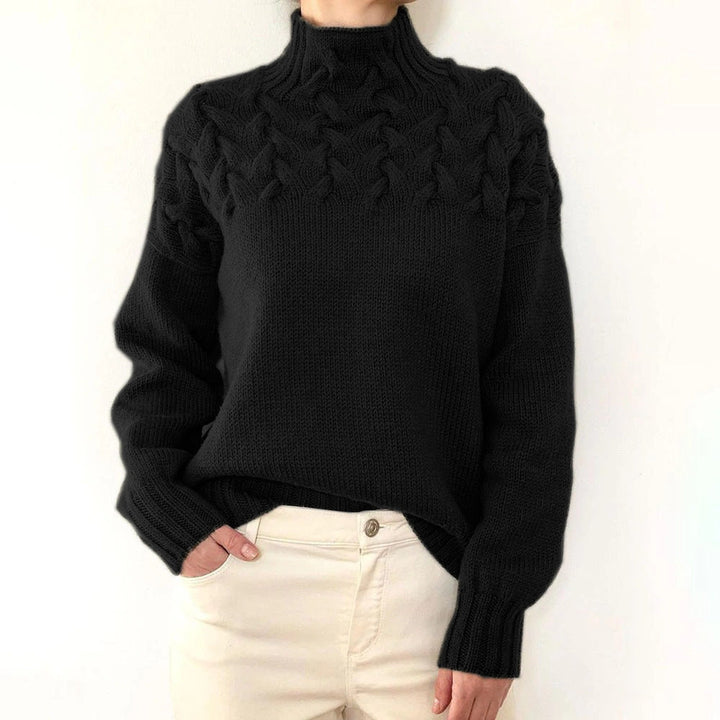 Women's cable knit turtleneck sweater with long sleeves and ribbed trims