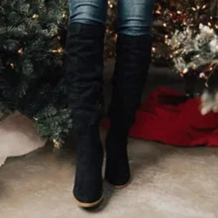 Women's high slouchy tube boots with flat heels and strap details